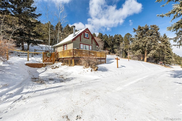 8537 S Doubleheader Hwy, Morrison, CO 80465 - snow covered property with a wooden deck