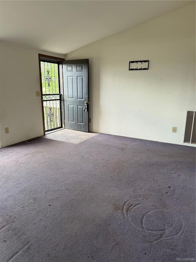 554 E Pleasant Ave, Byers, CO 80103 - spare room featuring carpet floors and vaulted ceiling
