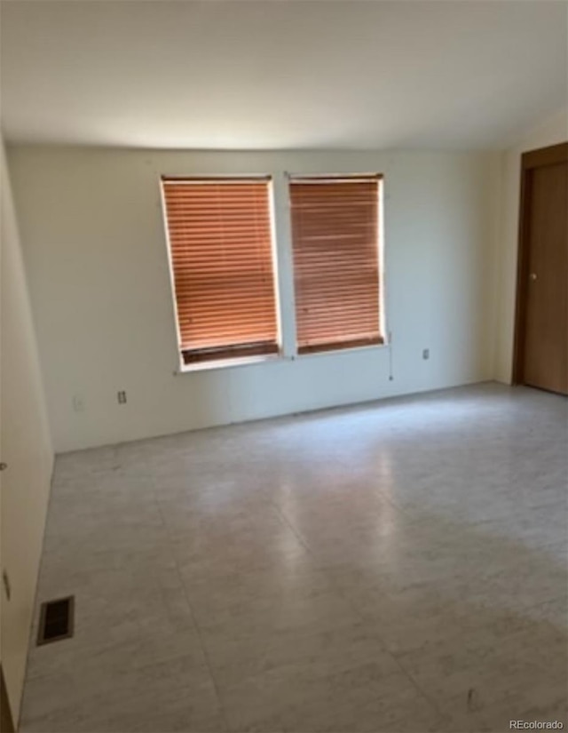 554 E Pleasant Ave, Byers, CO 80103 - empty room with tile patterned floors