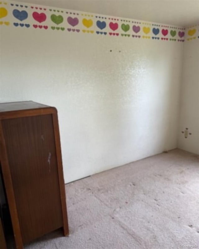 554 E Pleasant Ave, Byers, CO 80103 - view of carpeted spare room