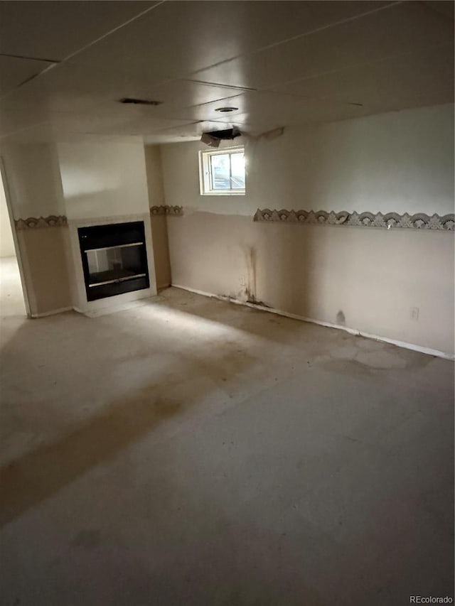 554 E Pleasant Ave, Byers, CO 80103 - below grade area featuring a glass covered fireplace