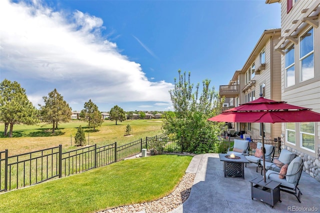 view of yard with a patio and an outdoor fire pit