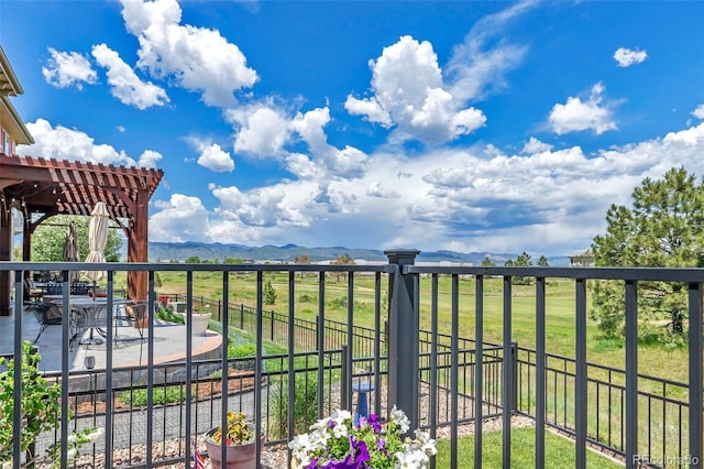 exterior space with a pergola and a mountain view