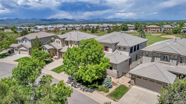 birds eye view of property with a mountain view