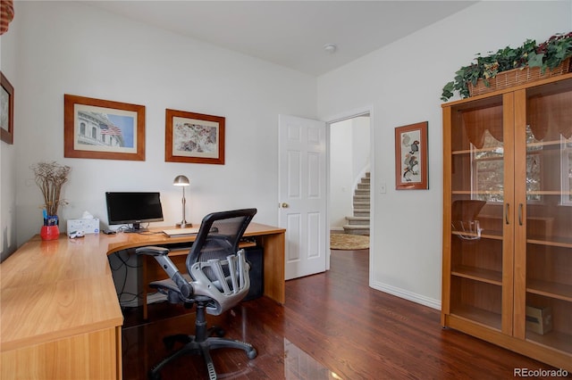 home office with dark wood-type flooring