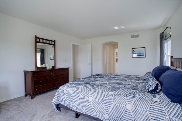 bedroom with light colored carpet