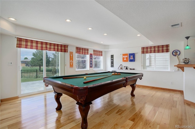 playroom with a textured ceiling, billiards, and light hardwood / wood-style flooring