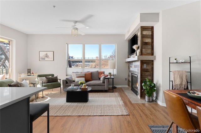 living room featuring hardwood / wood-style flooring and ceiling fan