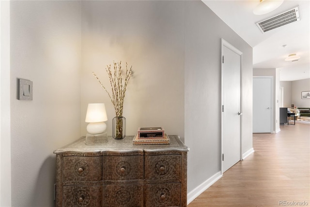 corridor featuring light hardwood / wood-style flooring