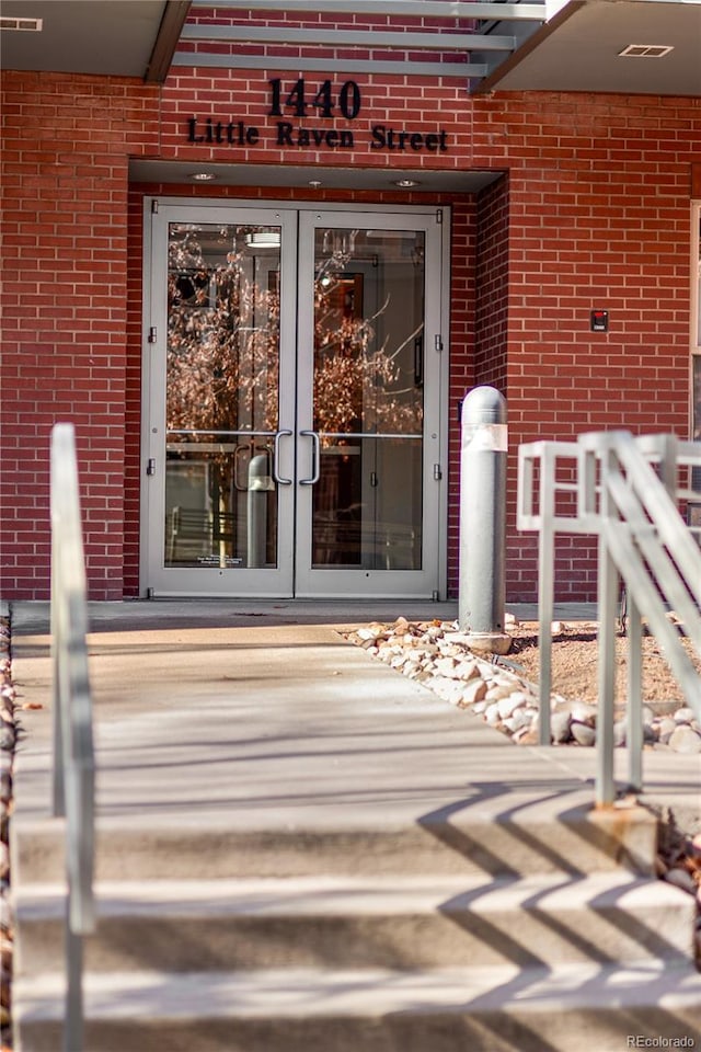 property entrance featuring french doors