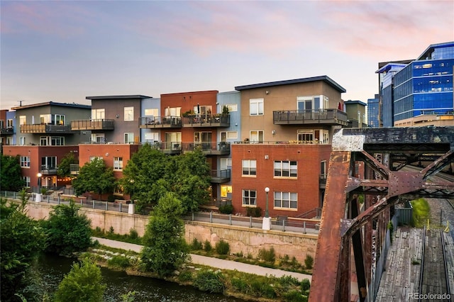 outdoor building at dusk featuring a water view