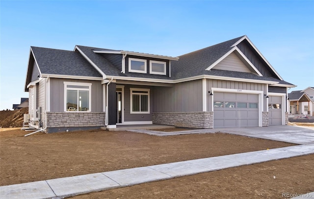 craftsman-style home featuring a garage and covered porch