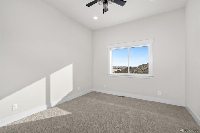 carpeted empty room with ceiling fan