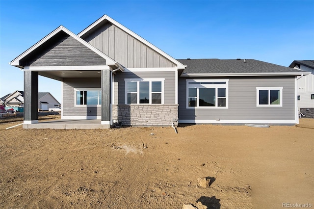 rear view of house featuring a yard and a patio area