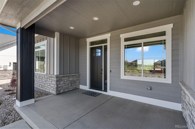 1369 Burt Ave, Berthoud, CO 80513 - doorway to property with board and batten siding and stone siding