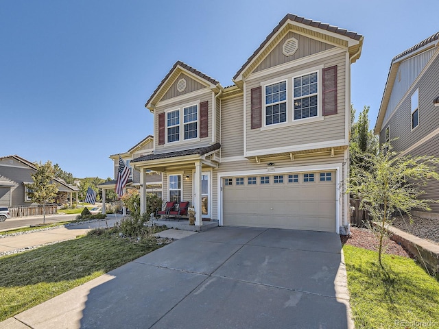 view of front of house with a garage and a porch