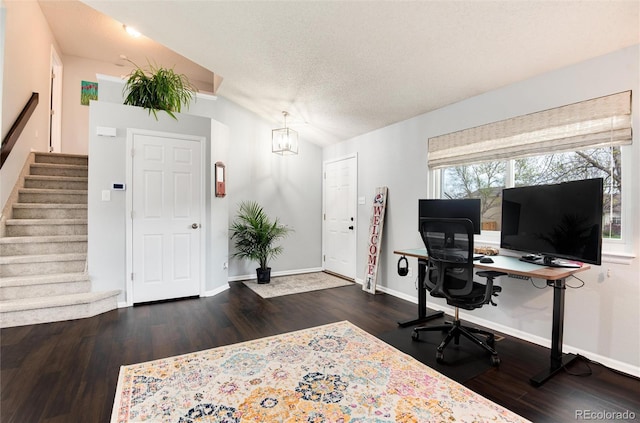office with baseboards, a textured ceiling, and wood finished floors