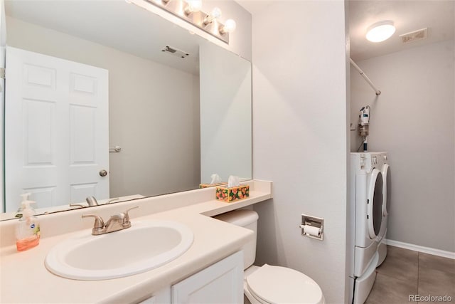 full bathroom with separate washer and dryer, visible vents, tile patterned flooring, and vanity
