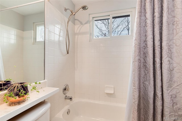 full bathroom featuring toilet and shower / tub combo with curtain