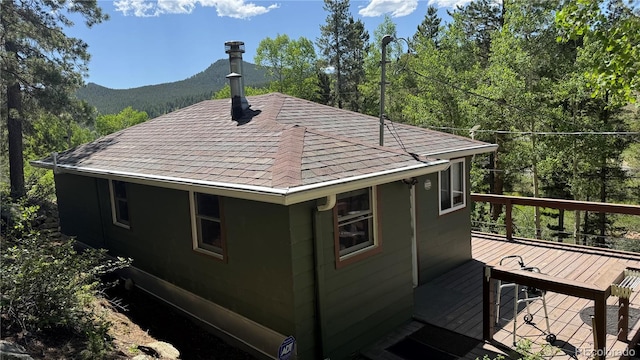 582 Pactolus Lake Rd, Black Hawk, CO 80422 - view of property exterior featuring a wooden deck and roof with shingles