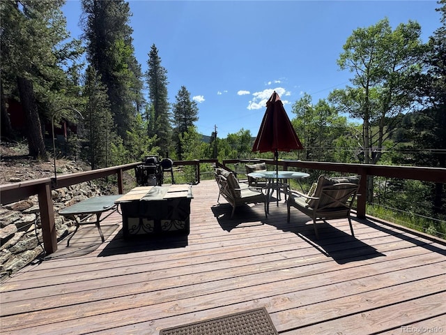 582 Pactolus Lake Rd, Black Hawk, CO 80422 - deck with outdoor dining area