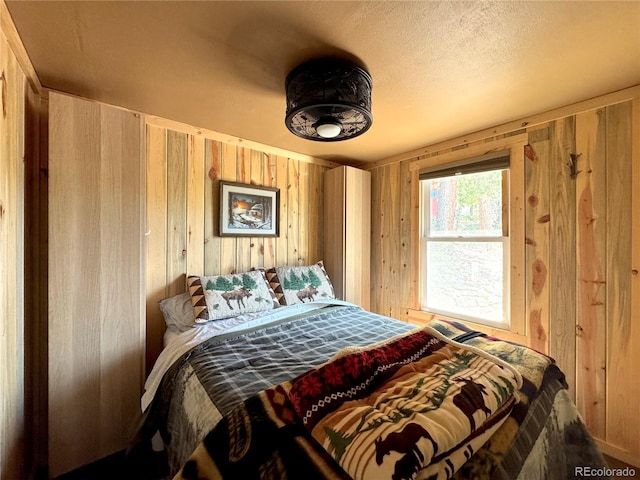 582 Pactolus Lake Rd, Black Hawk, CO 80422 - bedroom featuring wooden walls