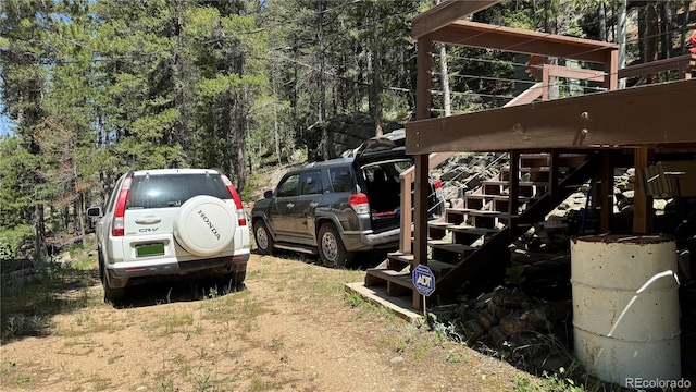 582 Pactolus Lake Rd, Black Hawk, CO 80422 - view of vehicle parking featuring stairway
