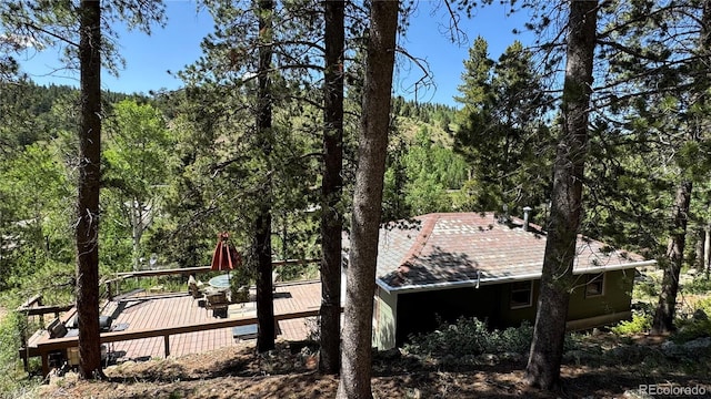 582 Pactolus Lake Rd, Black Hawk, CO 80422 - view of side of property with a view of trees and a deck