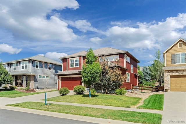 view of front facade featuring a front yard and a garage