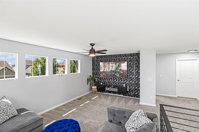 carpeted living room featuring ceiling fan