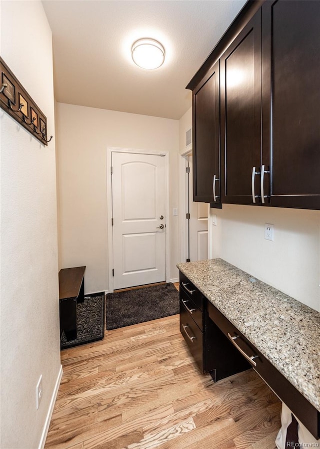 15948 Huckleberry Hts, Colorado Springs, CO 80908 - mudroom with light wood-type flooring and baseboards