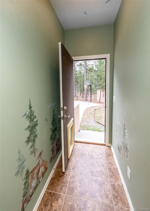 15948 Huckleberry Hts, Colorado Springs, CO 80908 - doorway to outside with baseboards
