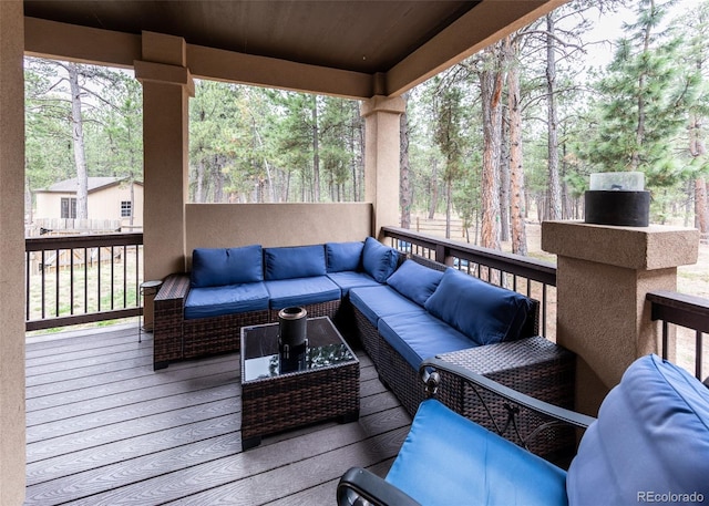 15948 Huckleberry Hts, Colorado Springs, CO 80908 - wooden terrace with an outdoor living space