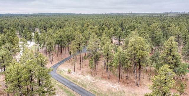 15948 Huckleberry Hts, Colorado Springs, CO 80908 - drone / aerial view featuring a wooded view