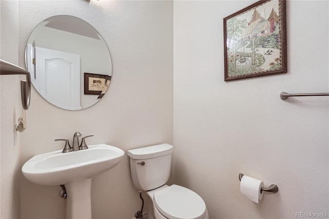 bathroom featuring toilet