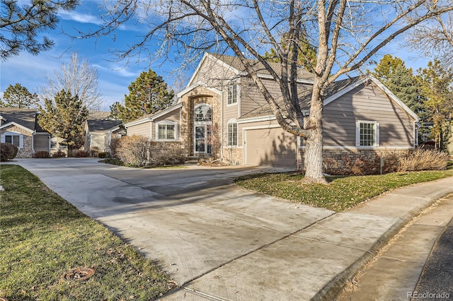 view of front facade featuring a front yard and a garage