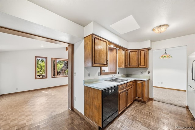 4631 Ashfield Dr, Boulder, CO 80301 - kitchen with black dishwasher, brown cabinetry, a skylight, light countertops, and open floor plan