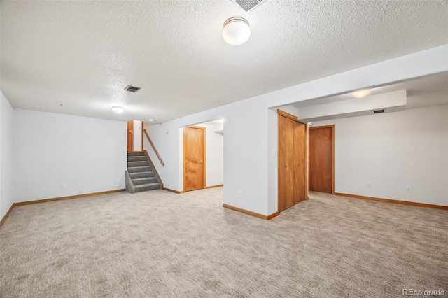 4631 Ashfield Dr, Boulder, CO 80301 - finished basement featuring a textured ceiling, stairs, and carpet flooring