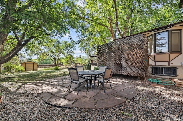 4631 Ashfield Dr, Boulder, CO 80301 - view of patio / terrace with a storage shed and outdoor dining space