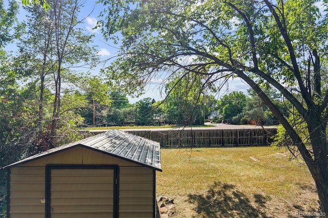 4631 Ashfield Dr, Boulder, CO 80301 - view of green lawn featuring a storage shed