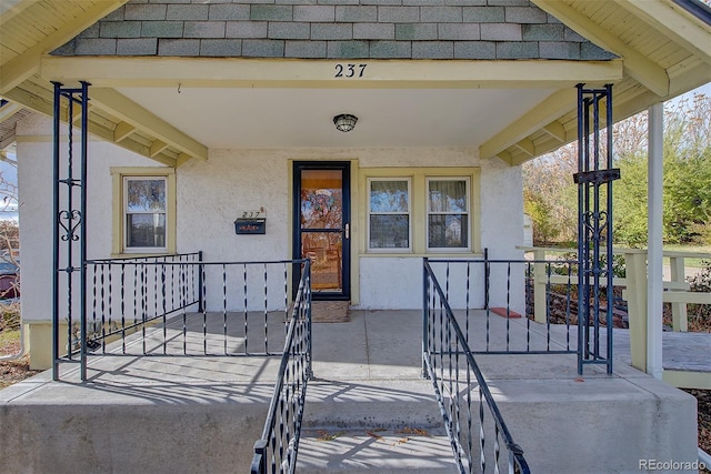 property entrance with covered porch