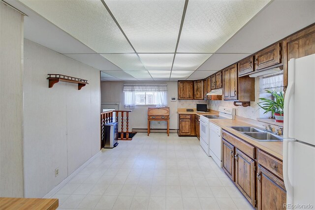 kitchen featuring a paneled ceiling, sink, a baseboard radiator, and white appliances