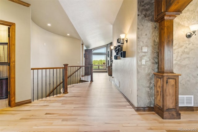 7830 Tannenbaum Rd, Colorado Springs, CO 80908 - corridor with wood finished floors, an upstairs landing, lofted ceiling, and baseboards