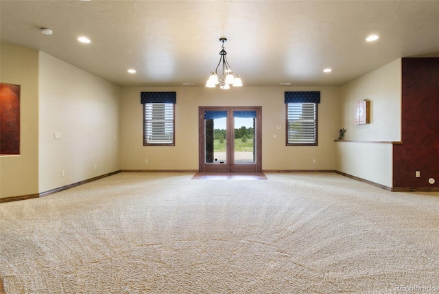 7830 Tannenbaum Rd, Colorado Springs, CO 80908 - carpeted spare room featuring healthy amount of natural light, recessed lighting, baseboards, and a chandelier