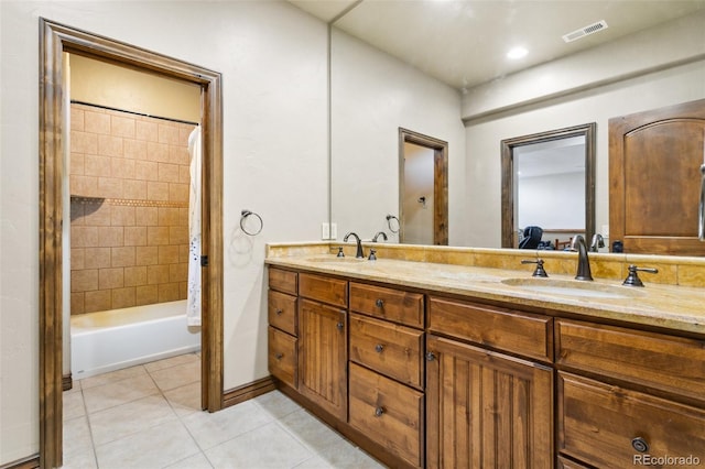 7830 Tannenbaum Rd, Colorado Springs, CO 80908 - full bath with double vanity, tile patterned flooring, and shower / washtub combination