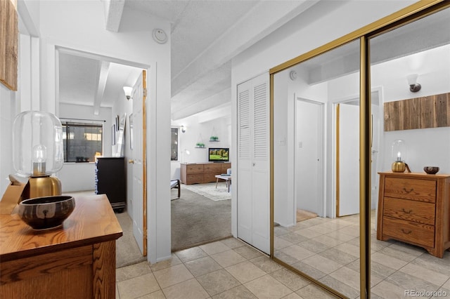 555 E 10th Ave Unit 15, Denver, CO 80203 - hall with light tile patterned floors and light colored carpet