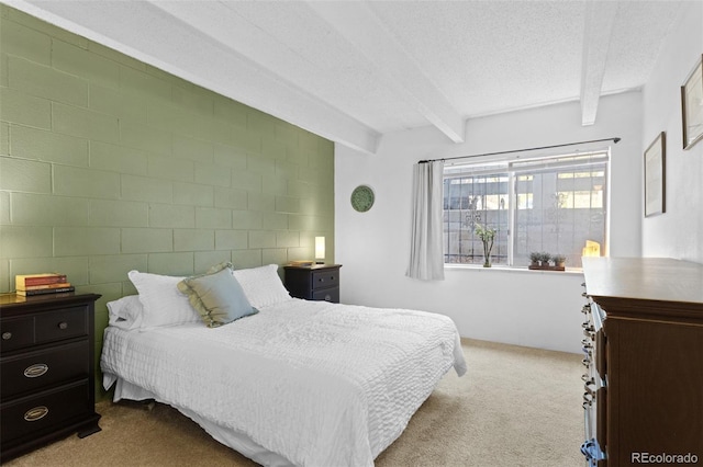 555 E 10th Ave Unit 15, Denver, CO 80203 - carpeted bedroom featuring beam ceiling and a textured ceiling