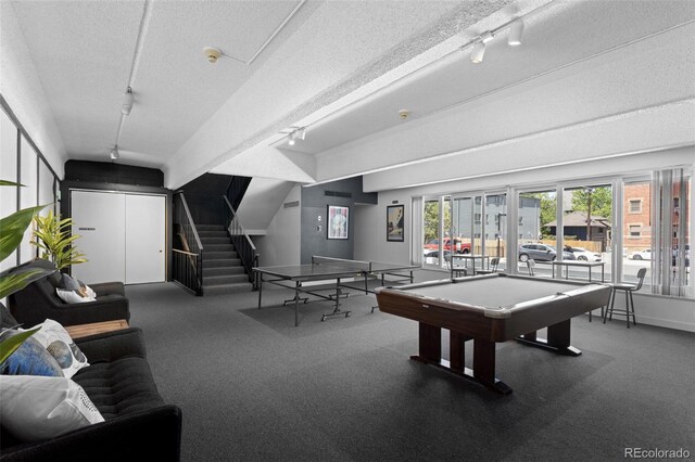 555 E 10th Ave Unit 15, Denver, CO 80203 - recreation room with track lighting, a textured ceiling, billiards table, carpet flooring, and baseboards