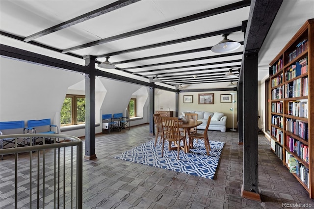 555 E 10th Ave Unit 15, Denver, CO 80203 - dining room with beamed ceiling, carpet, and baseboards