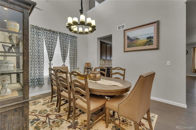 9476 Juniper Way, Arvada, CO 80007 - dining room with a chandelier and wood finished floors